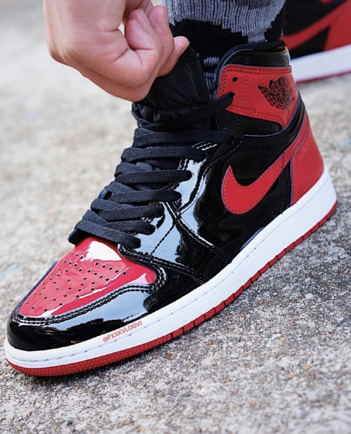 More images of the black and red patent Air Jordan 1 High OG Sneaker